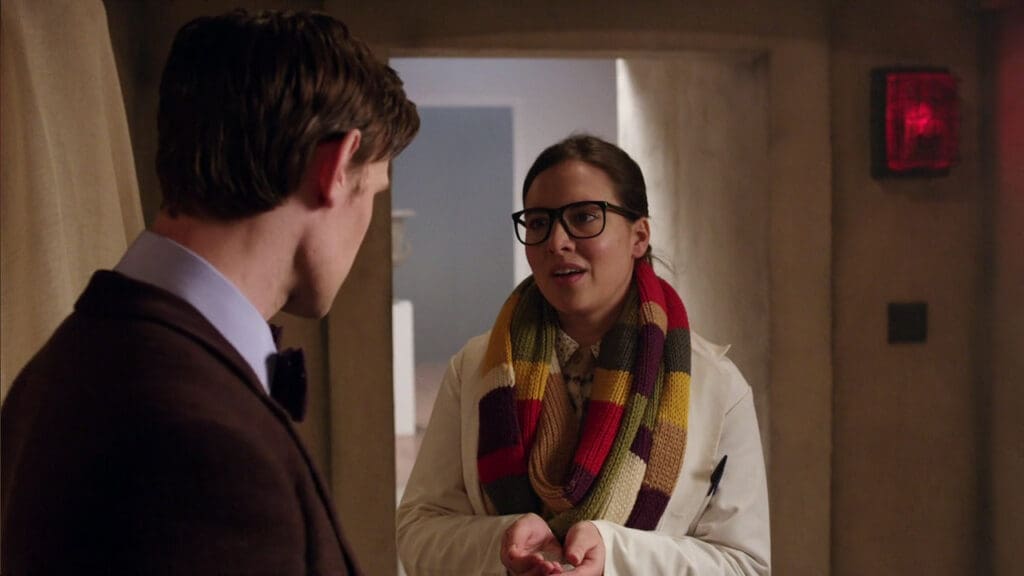 The Eleventh Doctor handing Osgood some stone dust