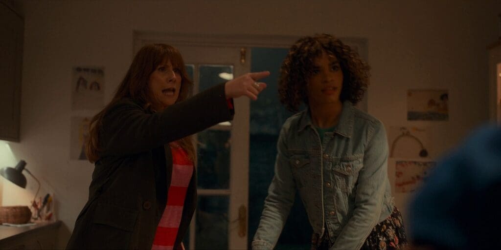 Donna and Rose. Donna is pointing angrily.