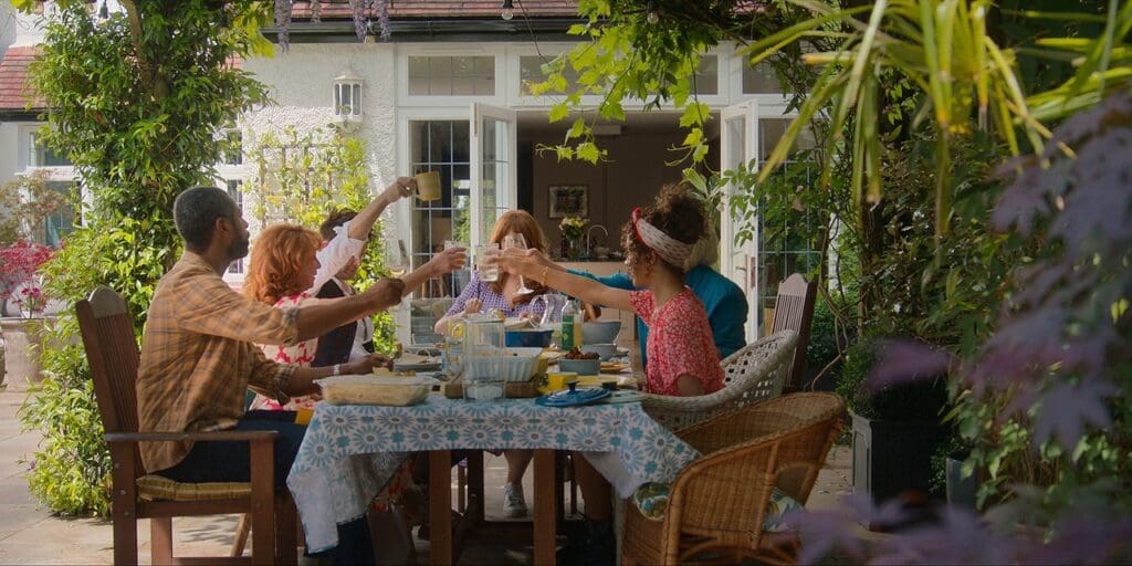 The 14th Doctor's family, saying a toast to Mad Aunty Mel.