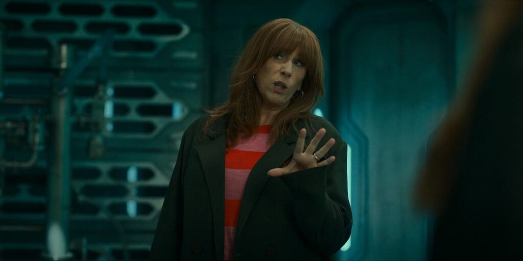 Donna gesturing at her duplicate