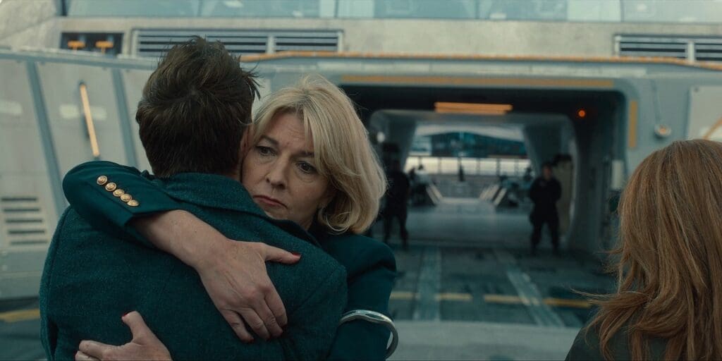 Kate and the 14th Doctor on the UNIT HQ Helipad. Kate is hugging him, looking worried.