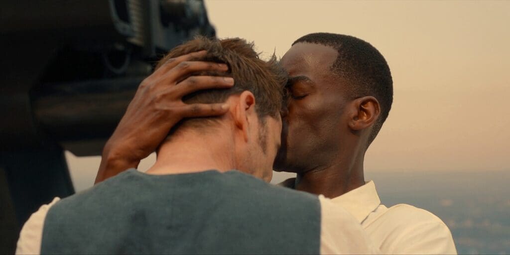 The 15th Doctor hugs the 14th and gives him a kiss on the forehead.