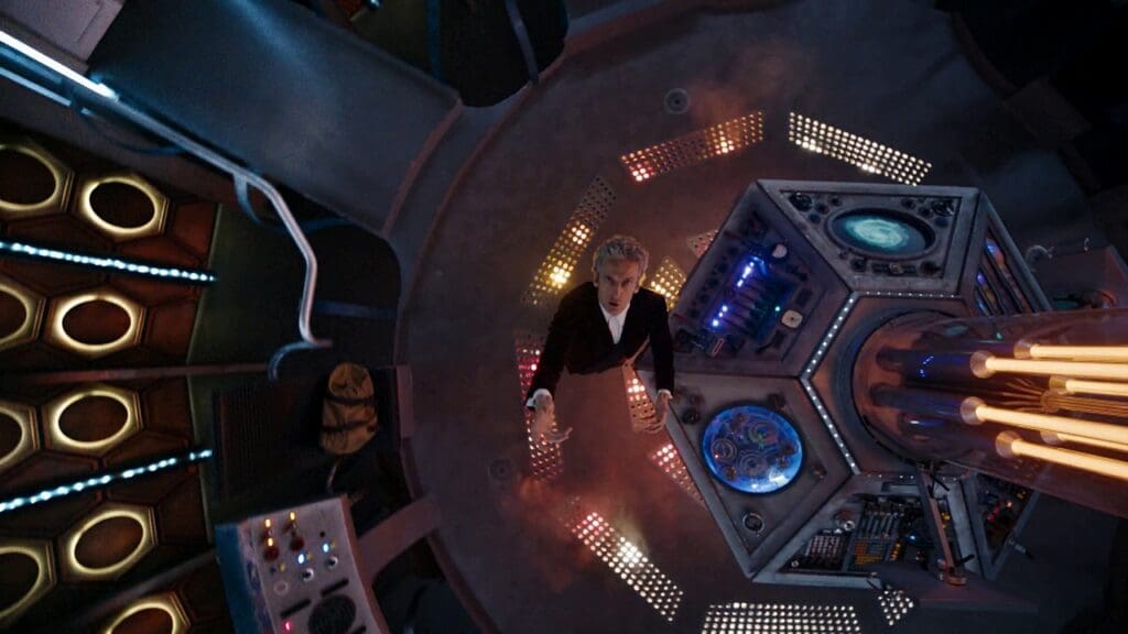 Vertical shot looking down on the Doctor in the TARDIS as he gesticulates