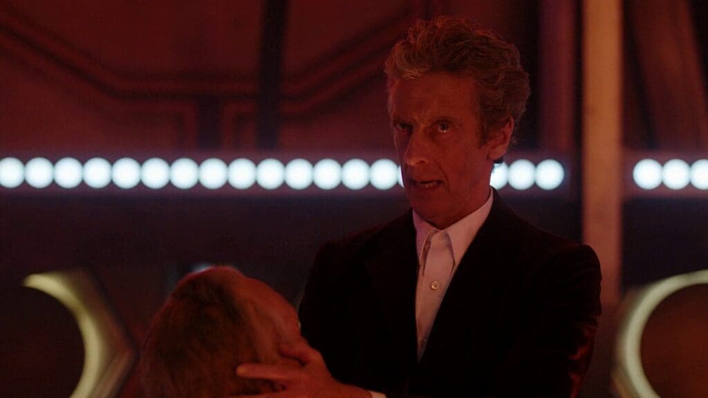 The Doctor in the TARDIS, holding the King's head