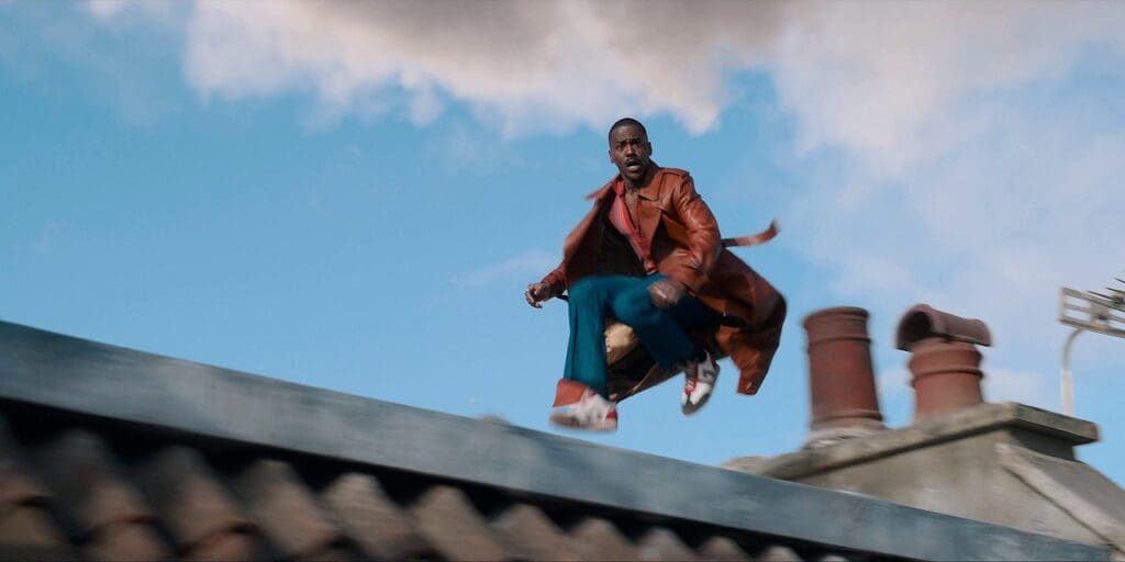 The Doctor running along rooftops