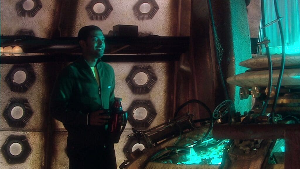 Mickey Smith in the TARDIS with a flask of tea