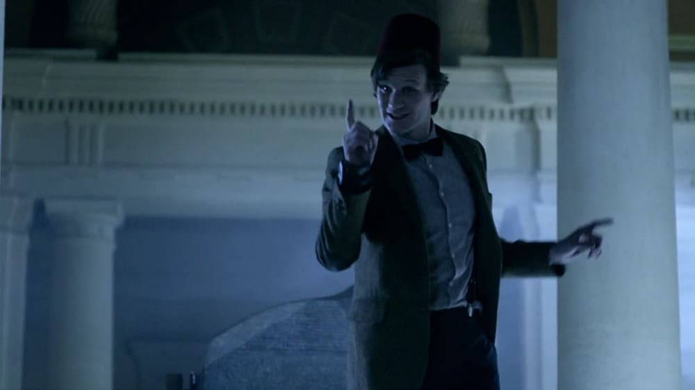 The Doctor, in the museum, wearing a fez