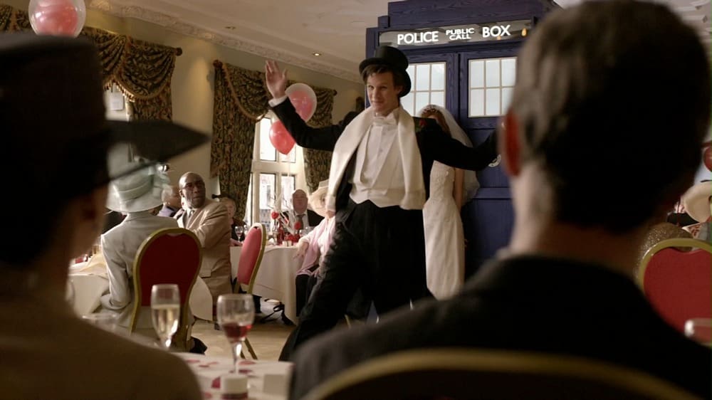 The Doctor, landed his TARDIS in the middle of the wedding, in a top hat and tails