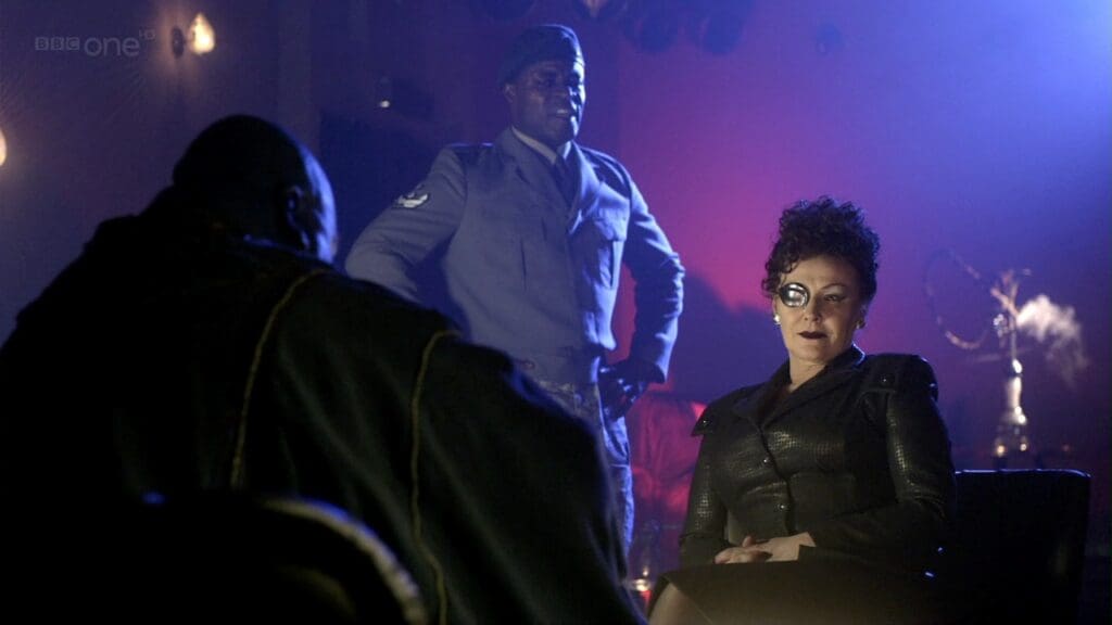 Madame Kovarian and General Manton, talking to Dorium