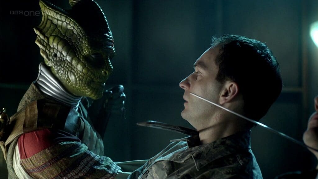 Vastra with a tied up prisoner